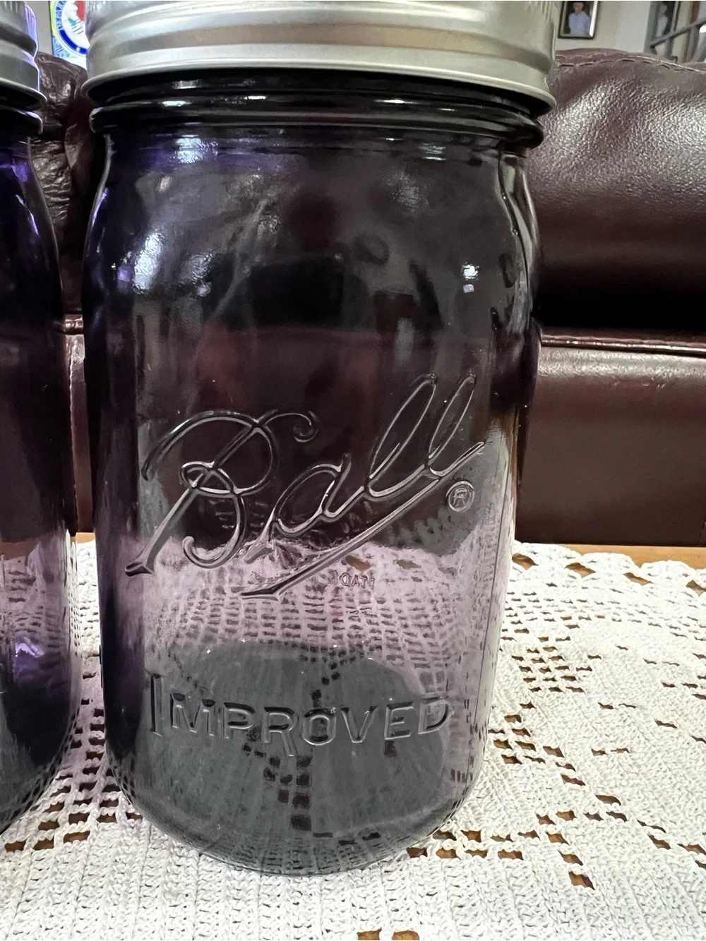 Two Ball Mason jars. “100th Anniversary. Purple jars. Excellent condition.